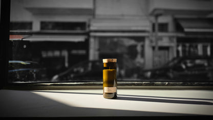 Mediterraneo Loft Botanical Candle with cork stopper in dramatic black and white window light